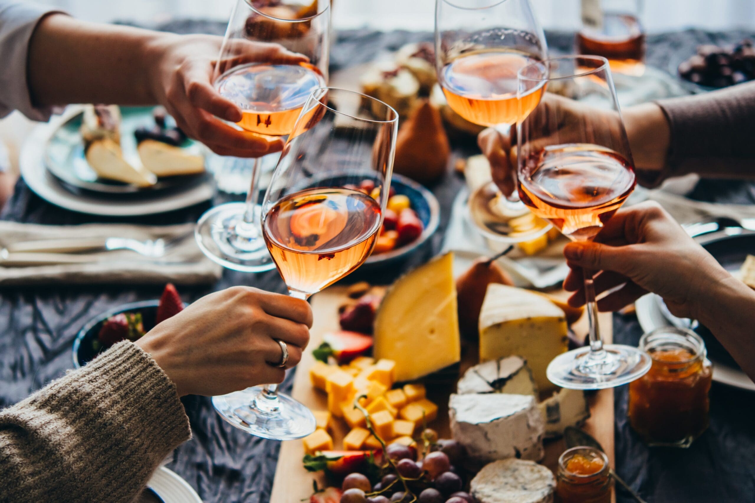 restaurant glasses of rose wine friendly celebration Latin Business Today