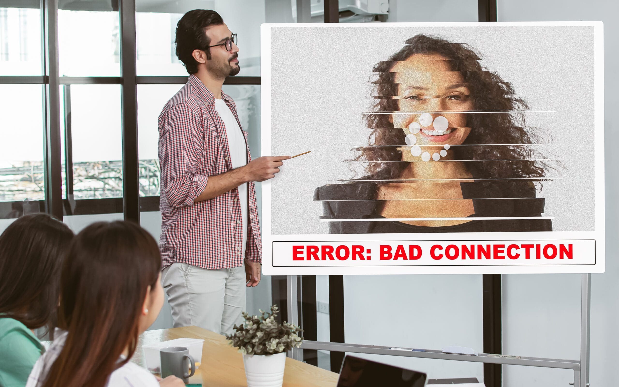 Selective focus on casual handsome business Caucasian man presenting and online meeting via trouble conference with bad connection and noise problem picture on screen.