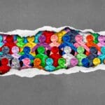 Discovering Diverse Culture and social justice inclusion as a group of people from different cultures under torn paper as a symbol for a united society or workplace unity