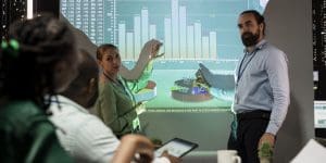 Management team sharing insight on statistics in night corporation meeting, providing initiatives to enhance operational
